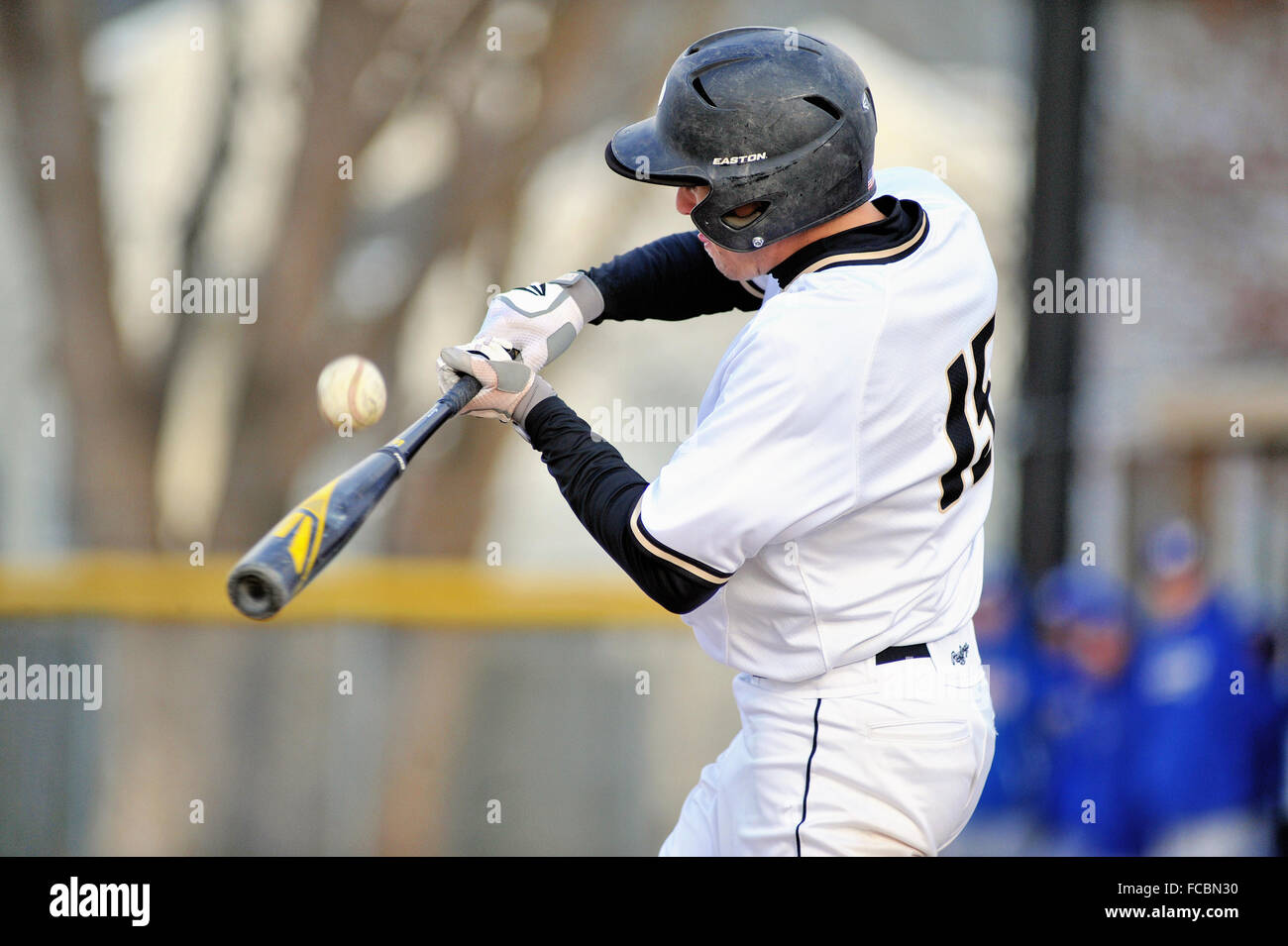 A batter making contact during a high school baseball game. USA. Stock Photo