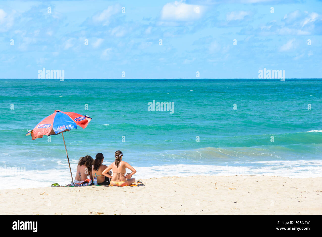 Three friends on the Beach. Porto de Galinhas, Brazil Stock Photo
