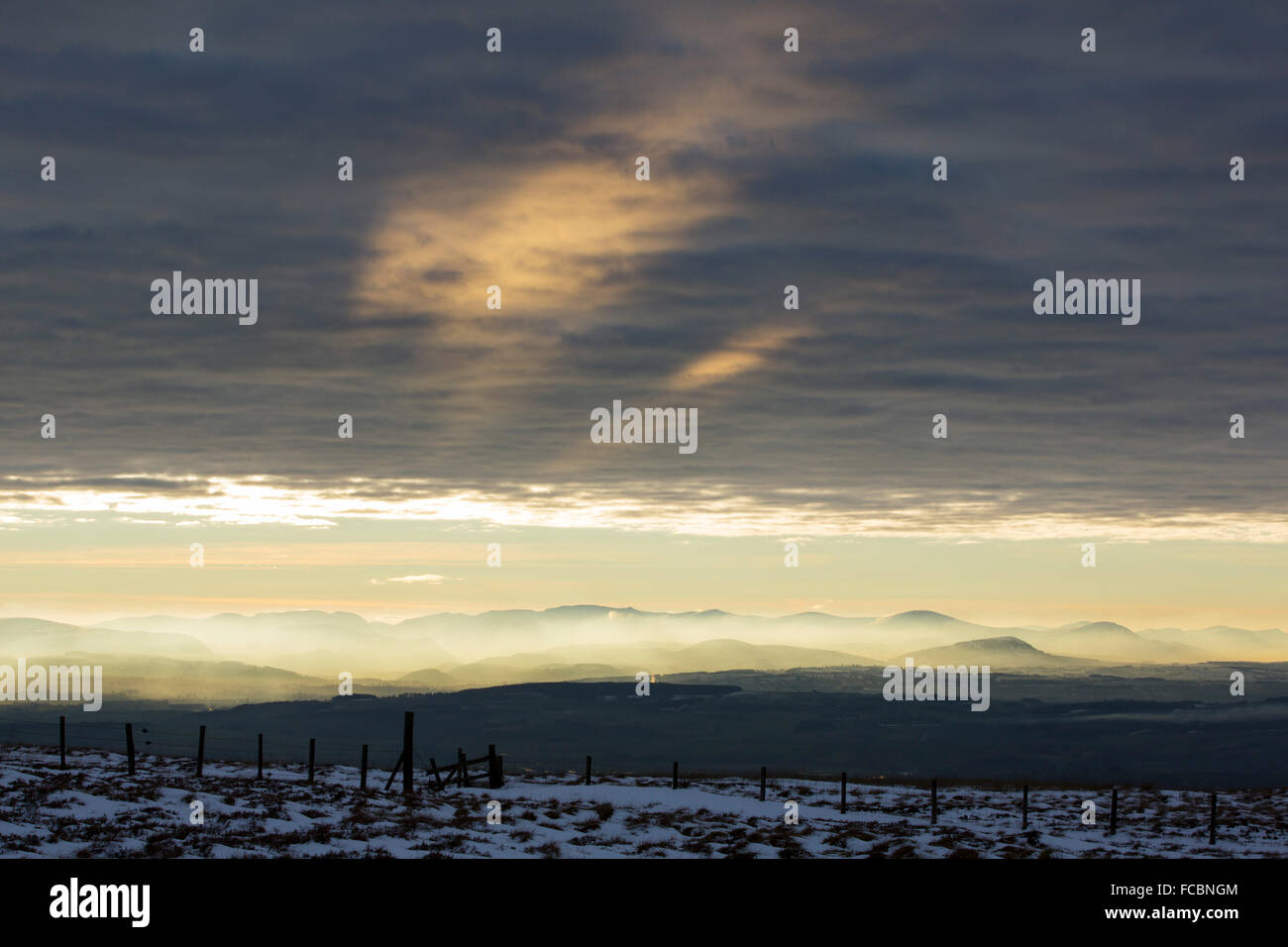 Looking towards the Lake District hills from Hartside in the North Pennines at sunset. Stock Photo