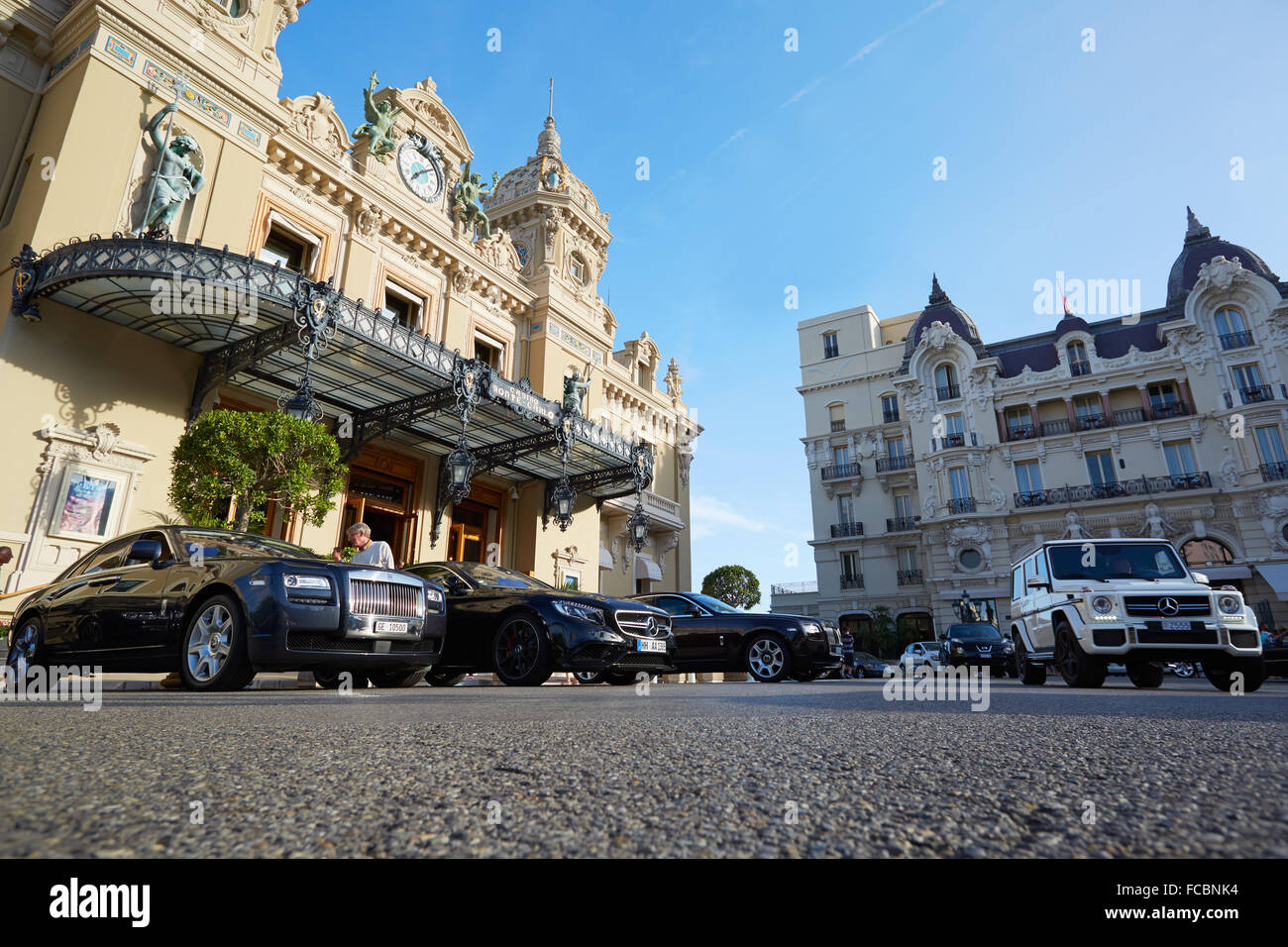 Grand Casino building and luxury cars in summer afternoon Stock Photo
