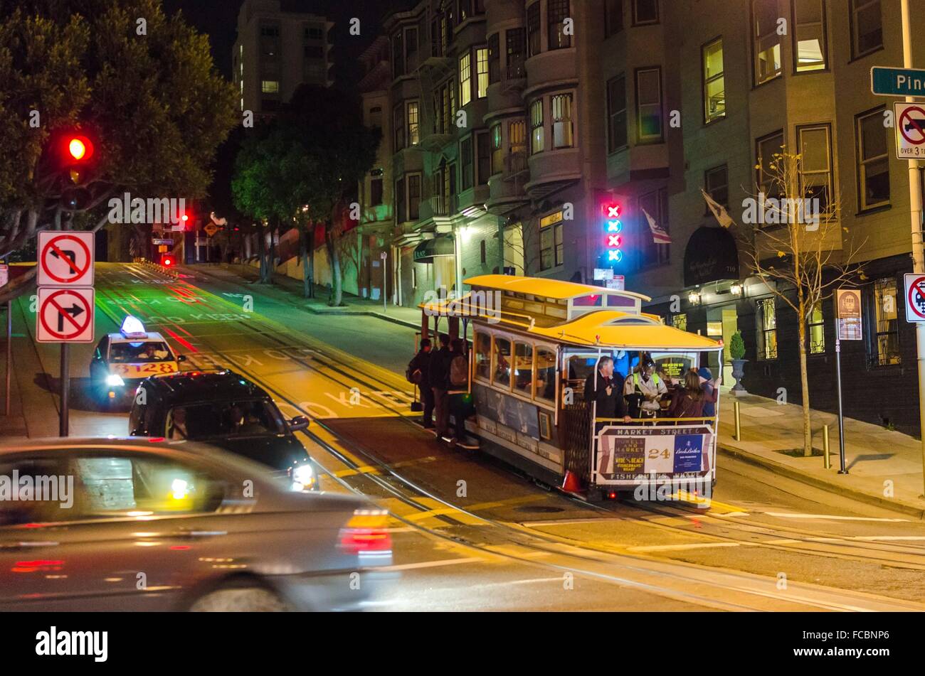 Night view of the traditional and historic cable car in San Francisco, California, United States. A view of the street car and p Stock Photo