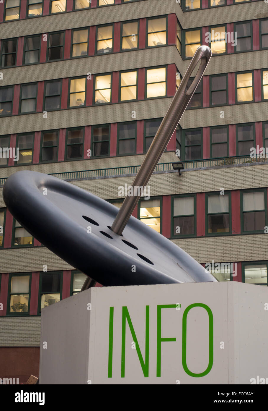 Information booth in NYC garment district with giant button and needle