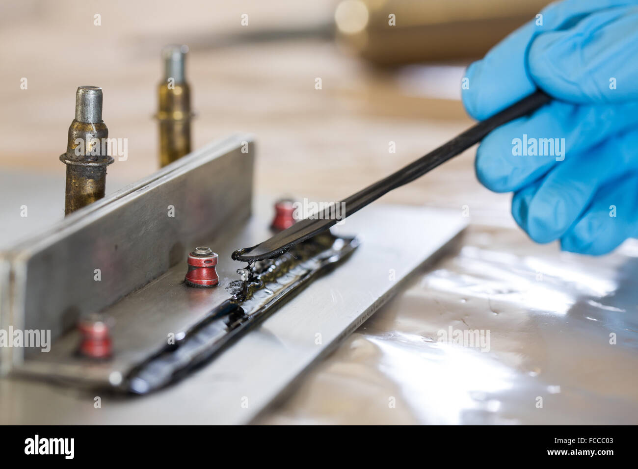 Manufacturing classroom doing caulking work Stock Photo Alamy