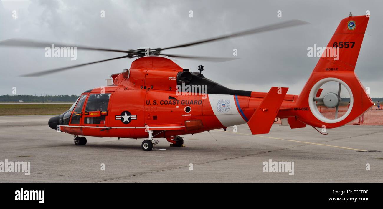 A U.S. Coast Guard HH-65 Dolphin / MH-65 Dolphin Eurocopter rescue helicopter parked on the runway Stock Photo