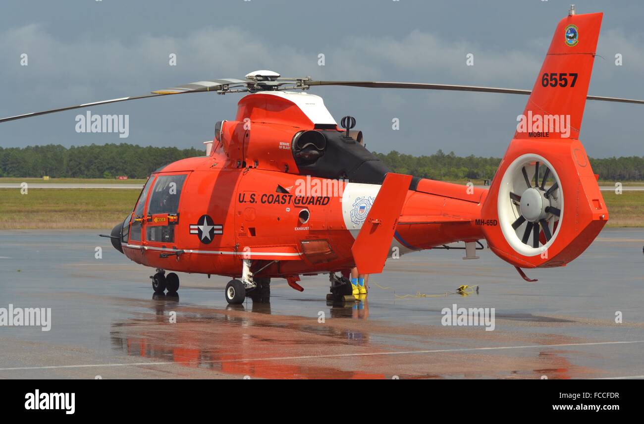 A U.S. Coast Guard HH-65 Dolphin / MH-65 Dolphin Eurocopter rescue helicopter parked on the runway Stock Photo