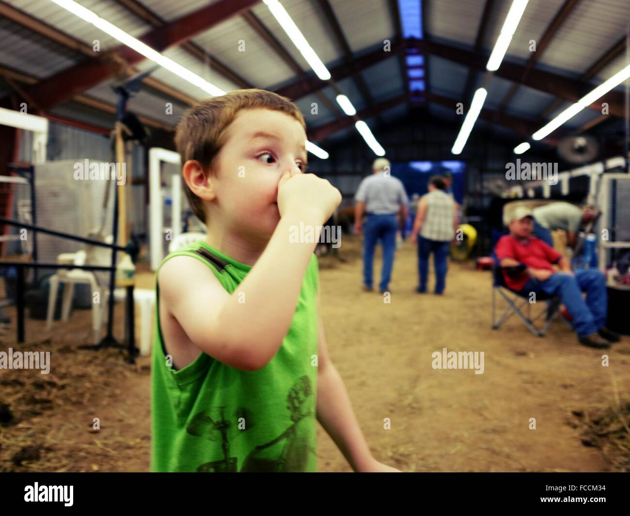 Boy Holding Nose At Stock Photo Alamy
