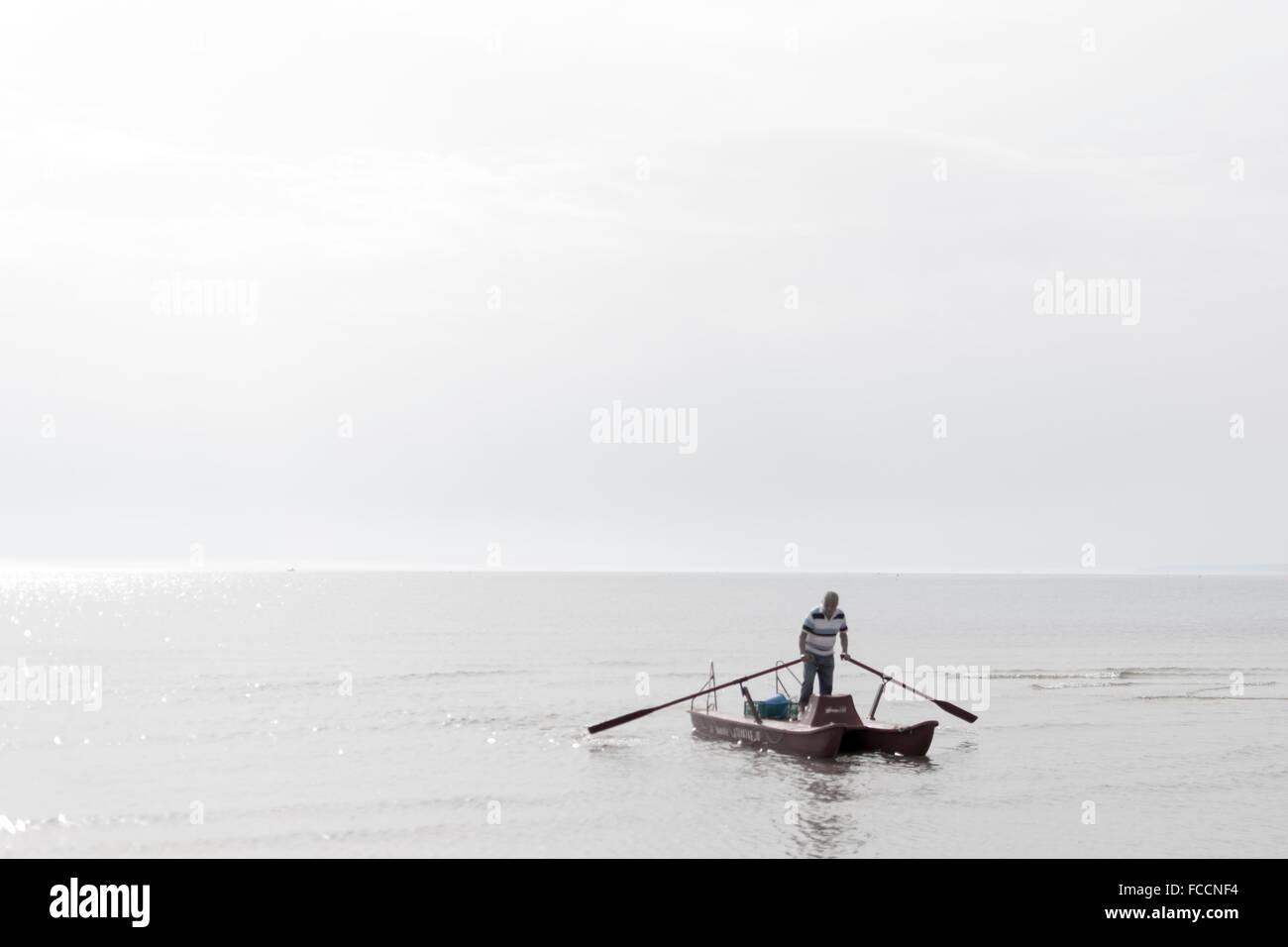 One Man On Floating Device Stock Photo