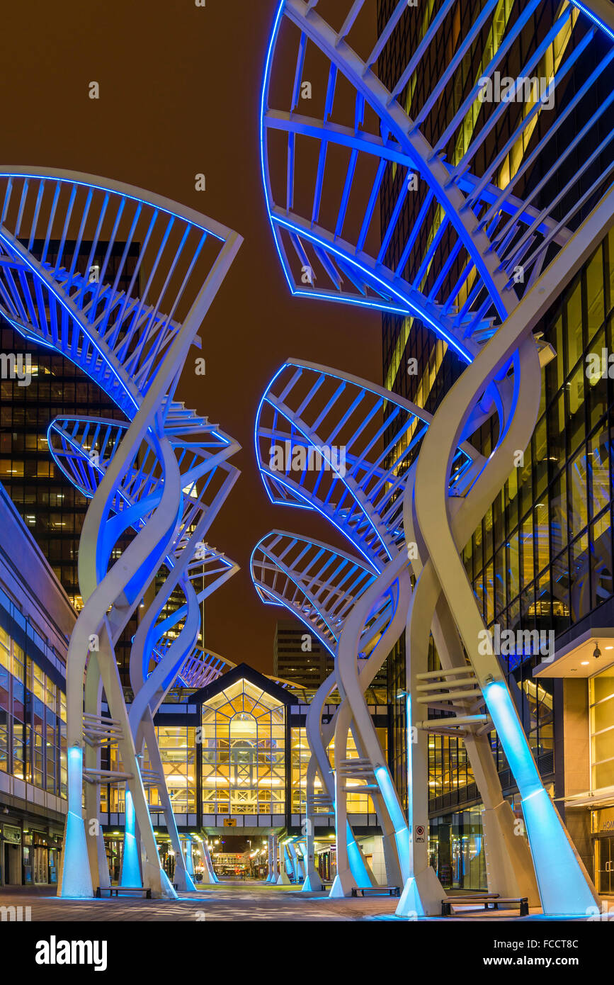 "Trees" sculpture designed to reduce wind gusts between the buildings on Stephen Avenue, night, downtown Calgary, Alberta Stock Photo