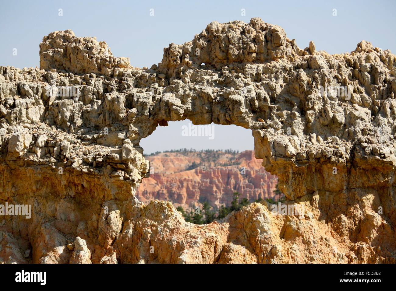 Natural Arch Of Rock In Canyon Stock Photo