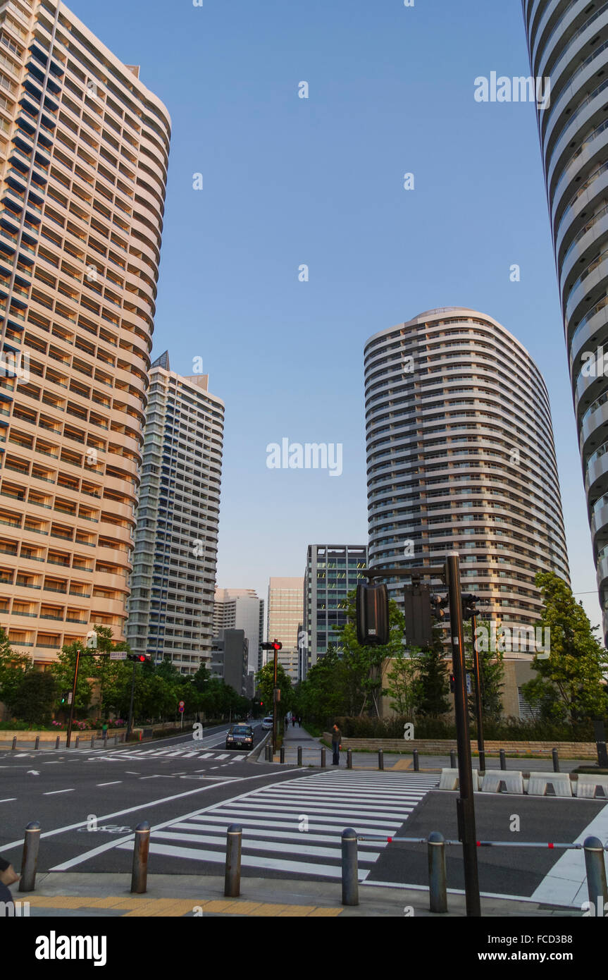 Intersection and high-rise residential buildings in the Minatomirai neighborhood, Yokohama, Japan. Late afternoon. Stock Photo