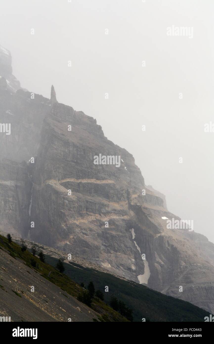 Fog And Snow On The Mountain Peak Stock Photo