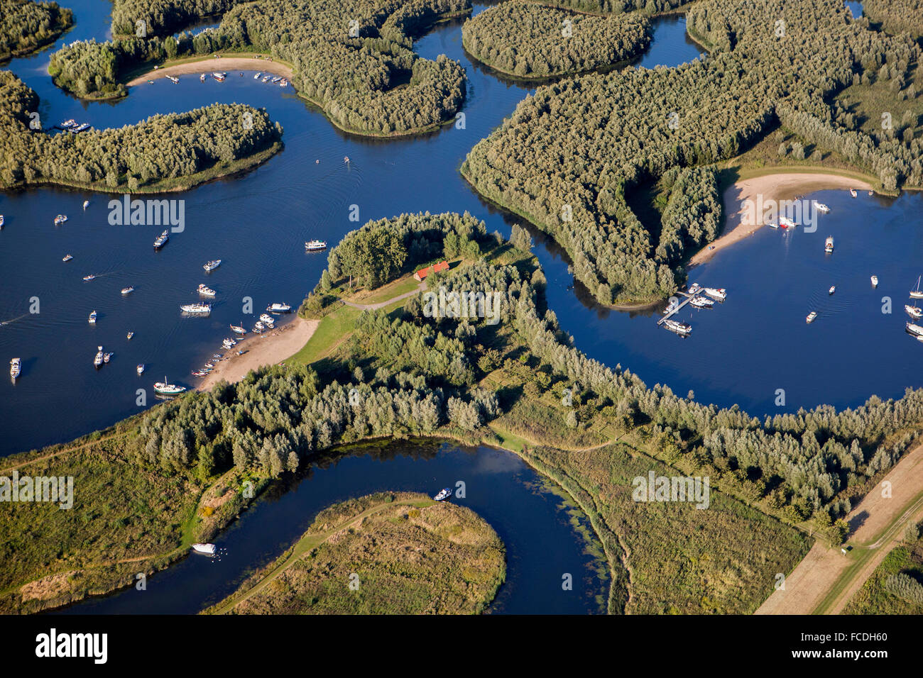 Netherlands, Werkendam, Biesbosch National Park. Fresh water tidal area. Yachts. Aerial Stock Photo