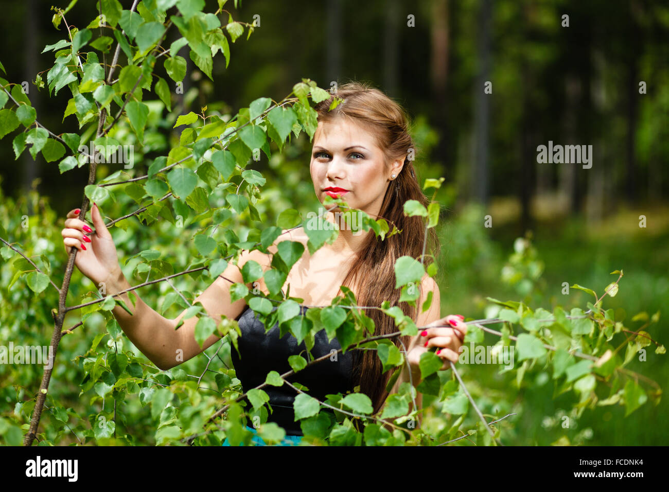 Portrait of a girl in a spring forest. Stock Photo