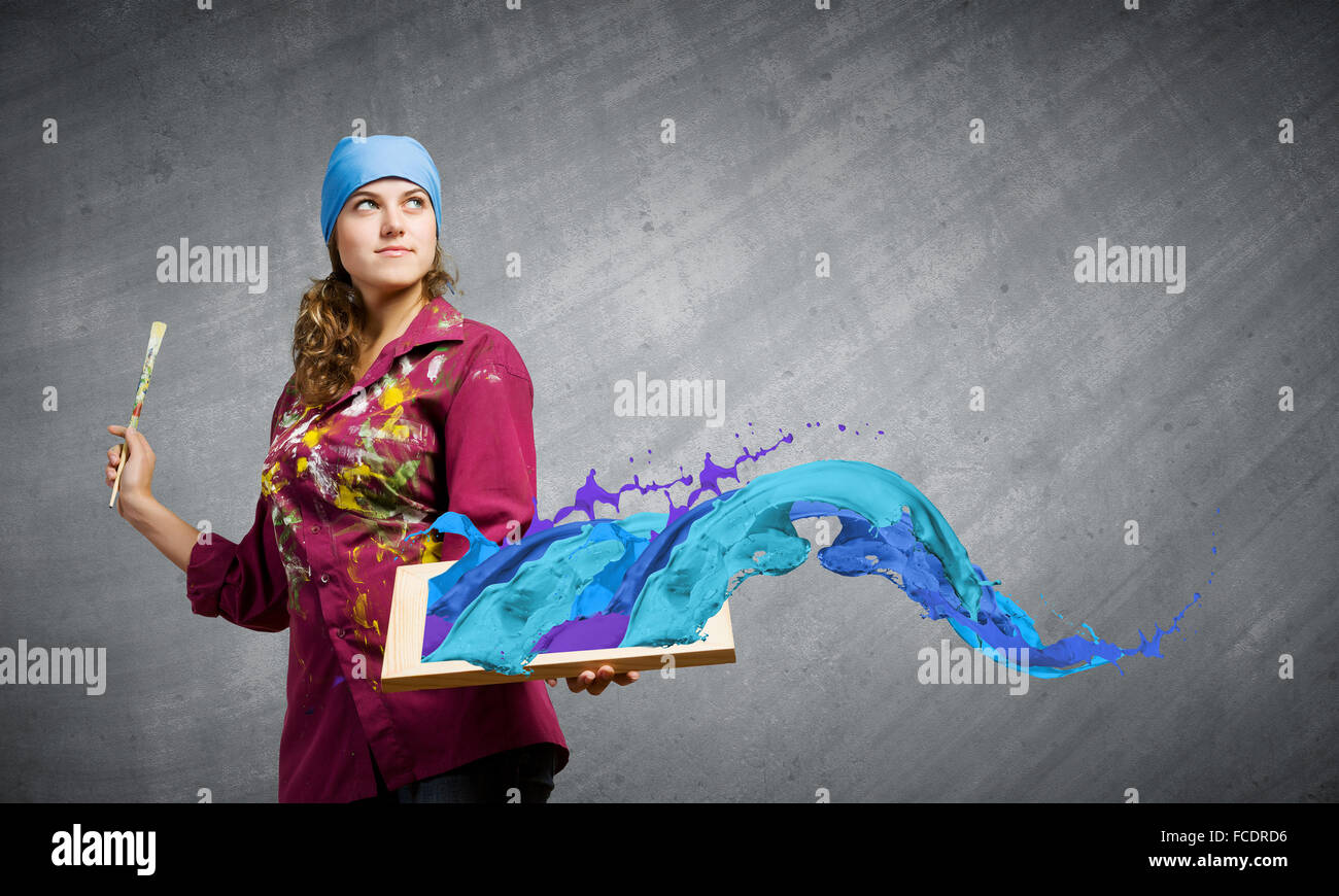 Young woman painter with palette and brush Stock Photo - Alamy