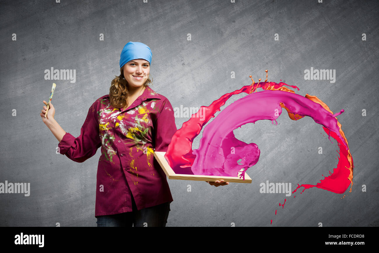 Young woman painter with palette and brush Stock Photo - Alamy