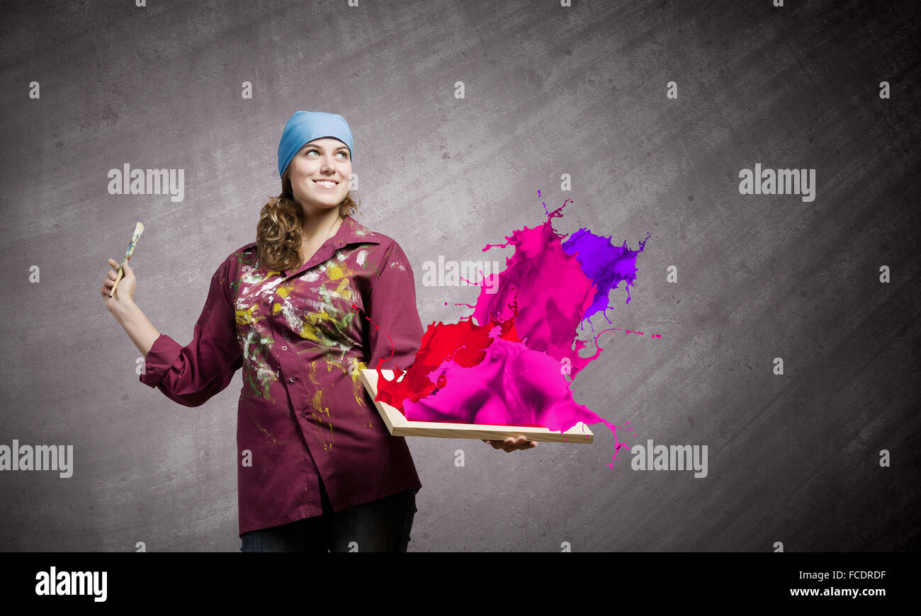 Young woman painter with palette and brush Stock Photo - Alamy