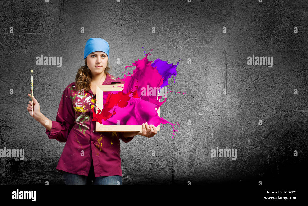 Young woman painter with palette and brush Stock Photo - Alamy
