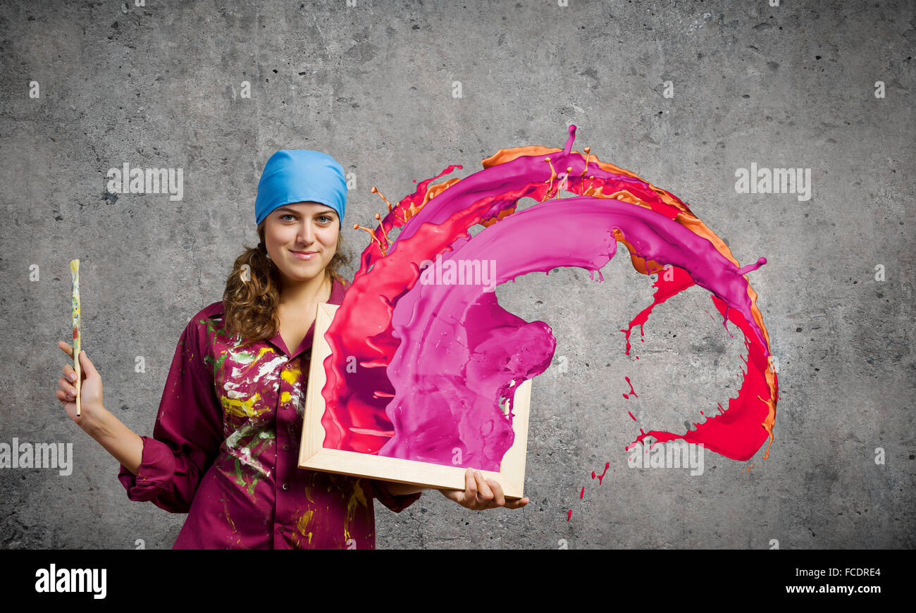 Young woman painter with palette and brush Stock Photo - Alamy