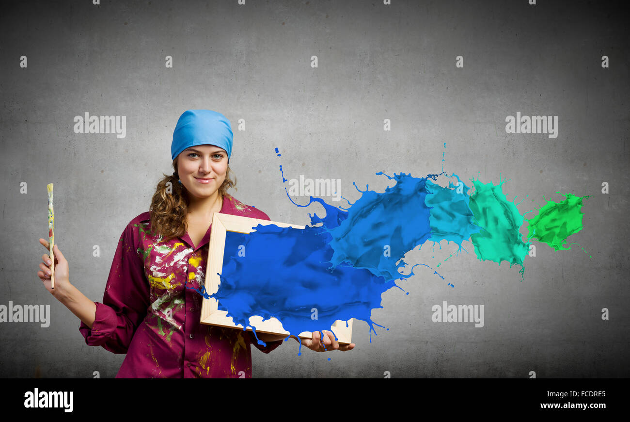 Young woman painter with palette and brush Stock Photo - Alamy