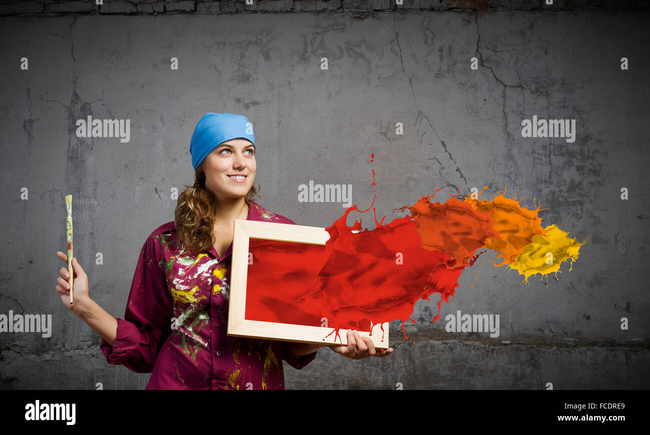 Young woman painter with palette and brush Stock Photo - Alamy