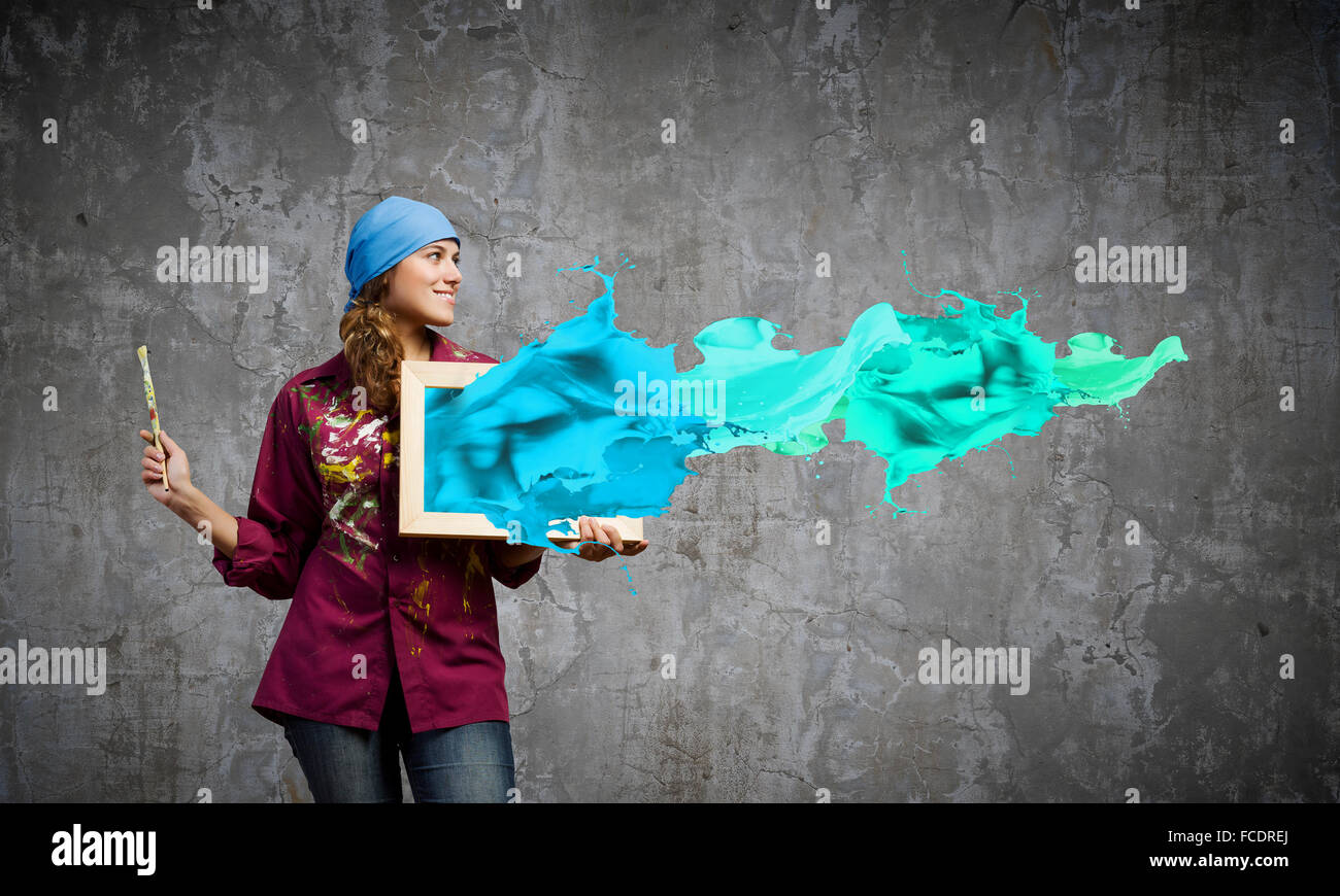 Young woman painter with palette and brush Stock Photo - Alamy