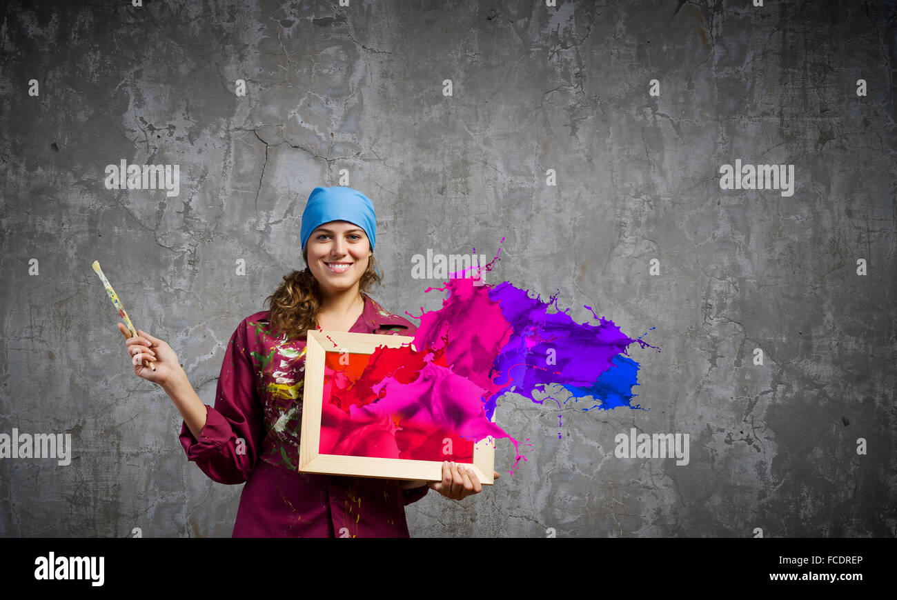 Young woman painter with palette and brush Stock Photo - Alamy