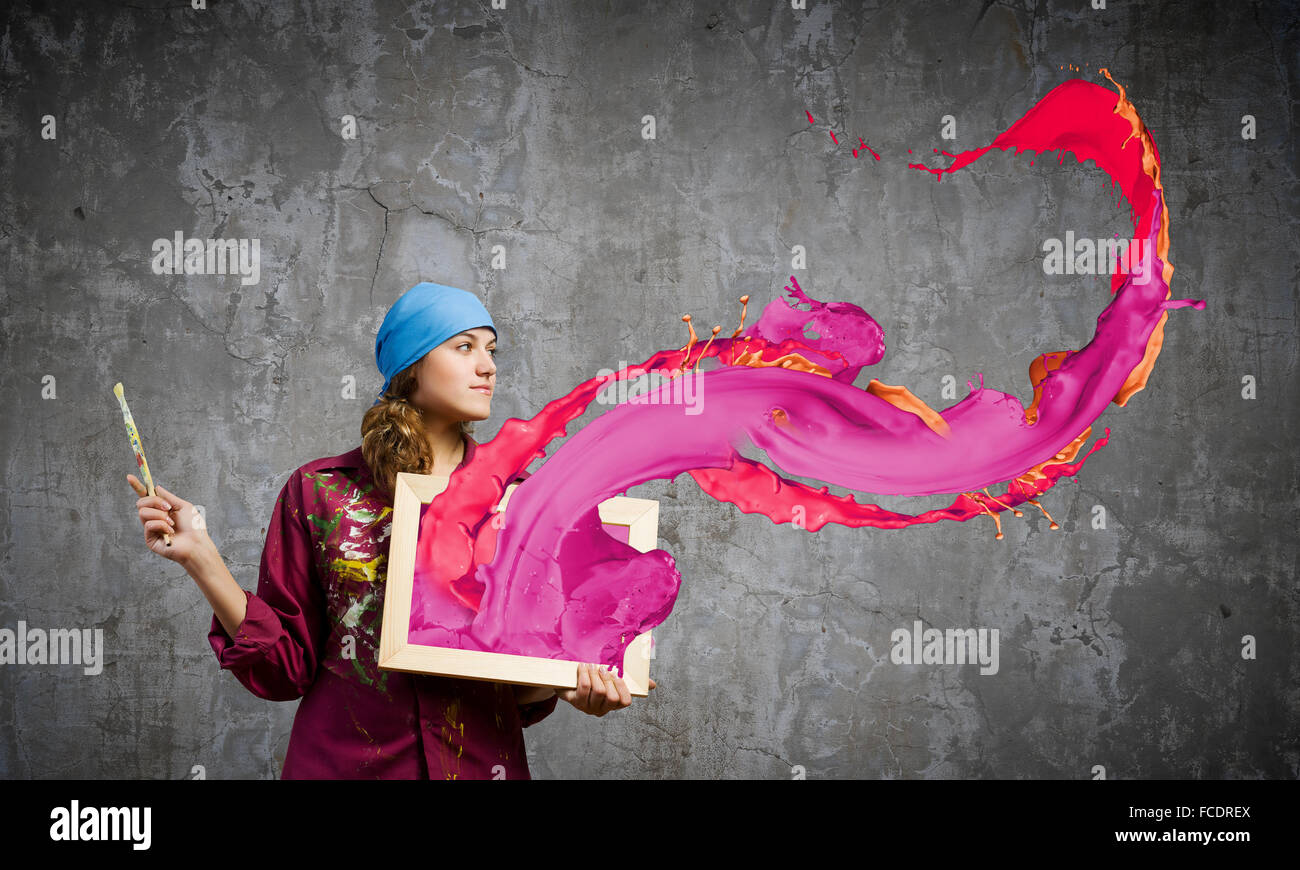 Young woman painter with palette and brush Stock Photo - Alamy