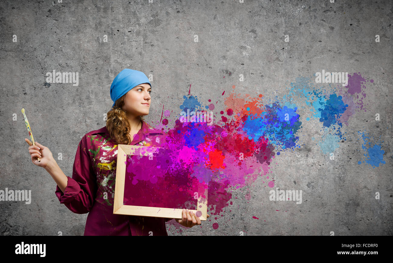 Young woman painter with palette and brush Stock Photo - Alamy