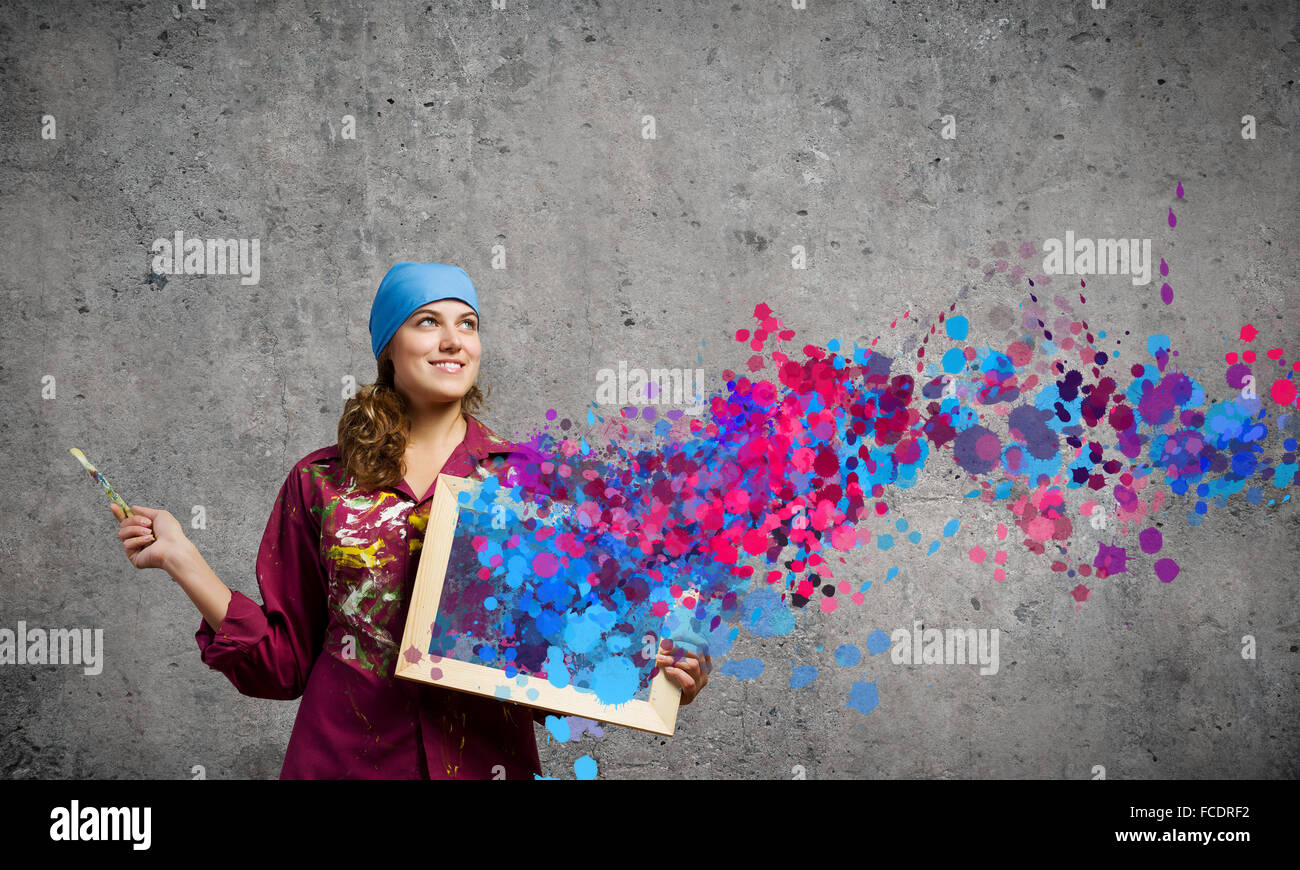 Young woman painter with palette and brush Stock Photo - Alamy