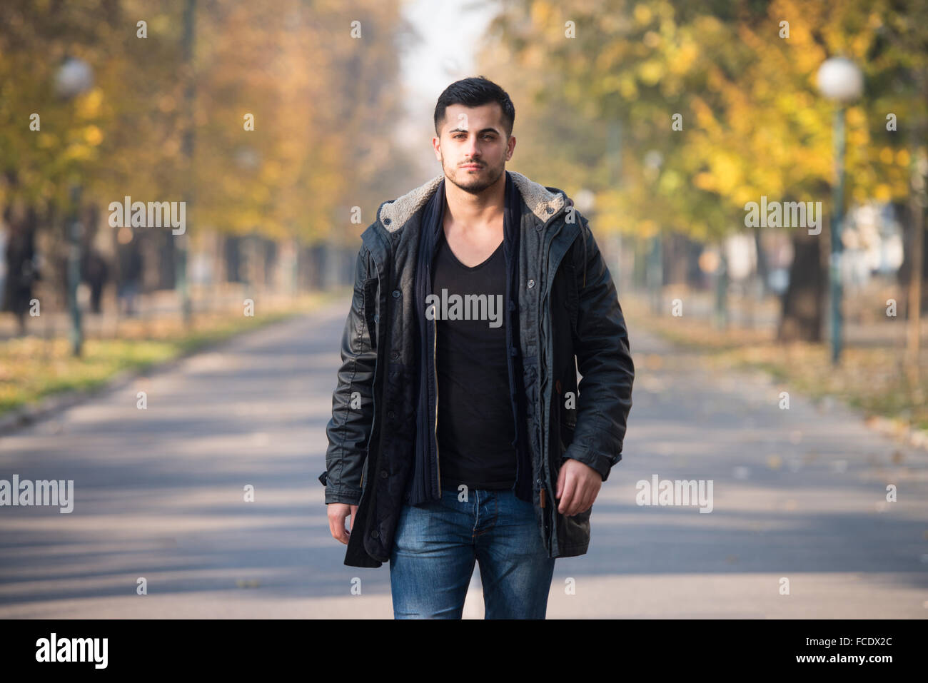 Portrait man walking through trees hi-res stock photography and images ...
