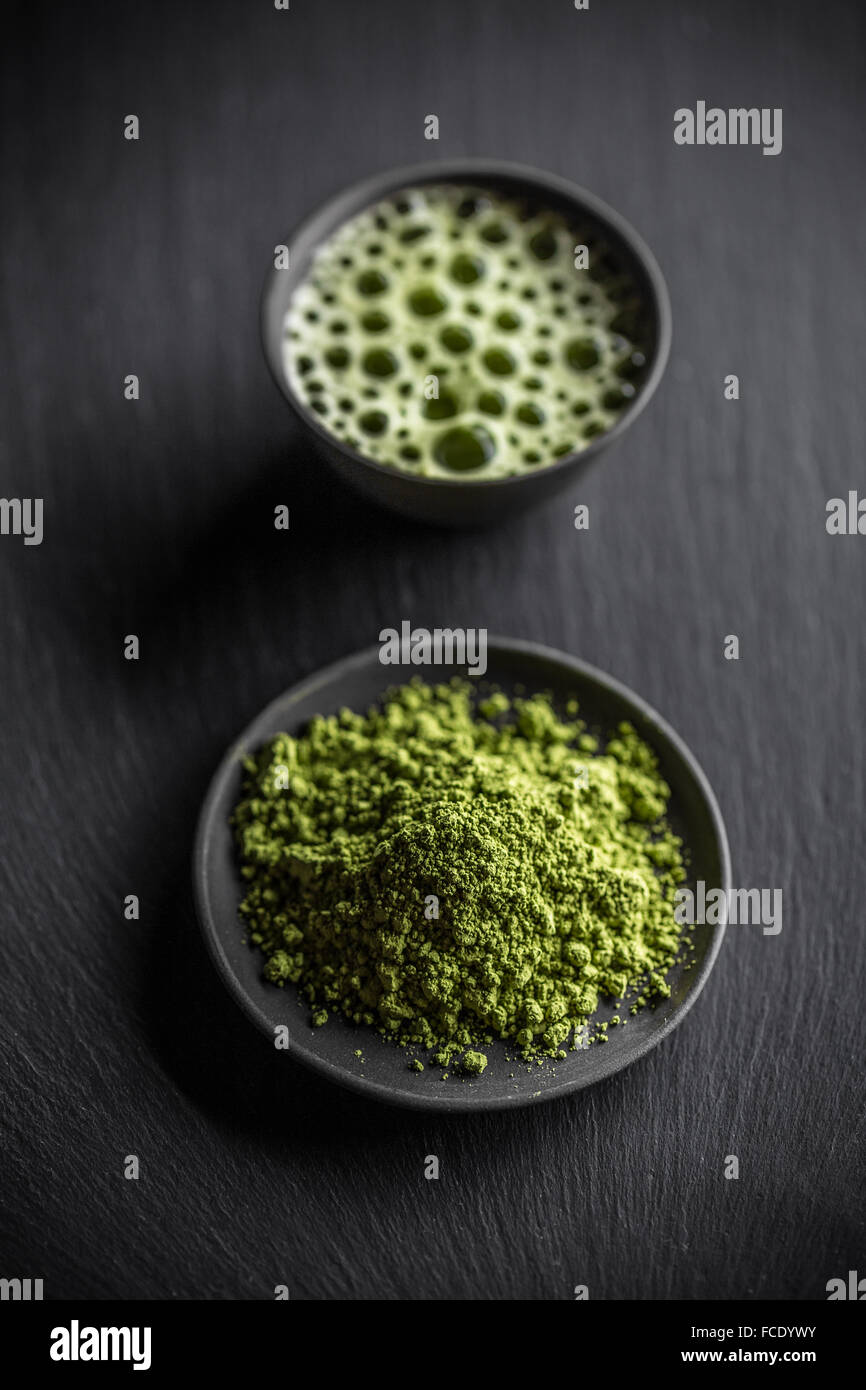 Powdered green tea, matcha on black background Stock Photo