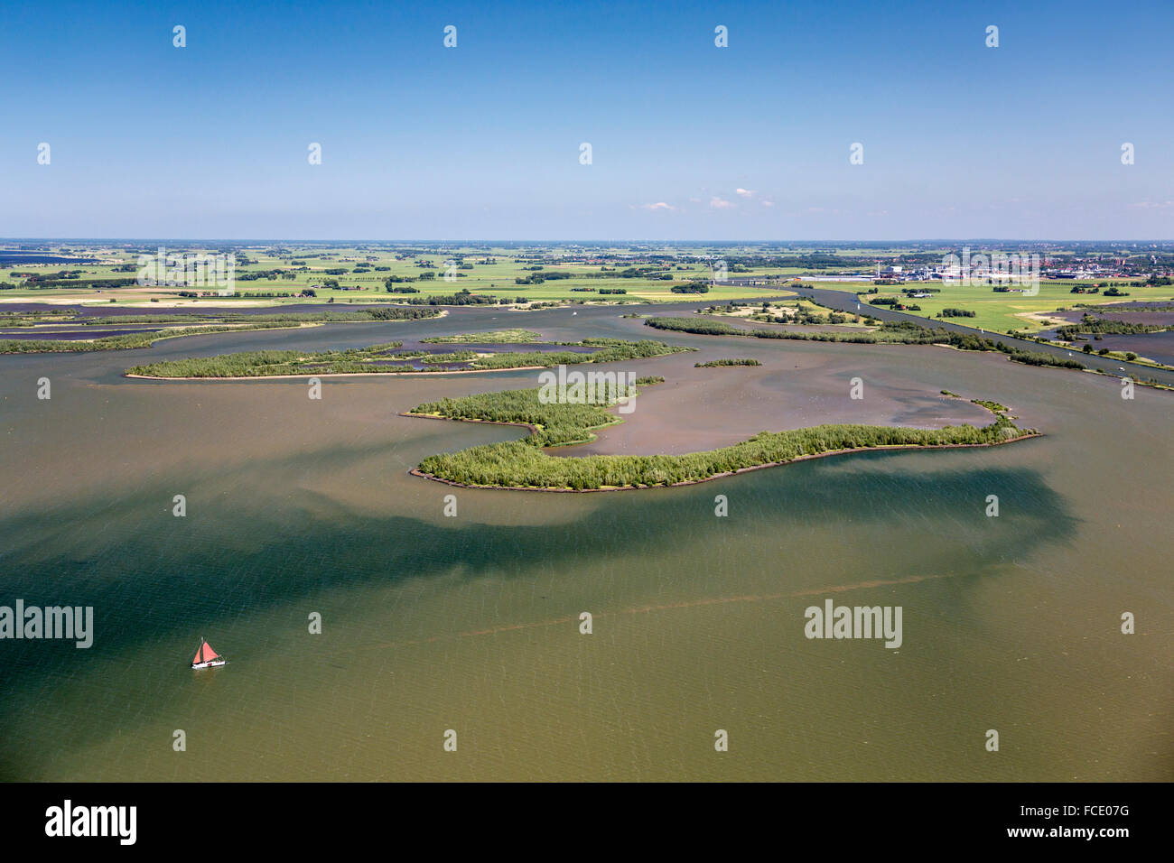 Netherlands, Kampen, Mound of IJssel river in lake called Ketelmeer. Nature reserve IJsselmoding. Aerial Stock Photo