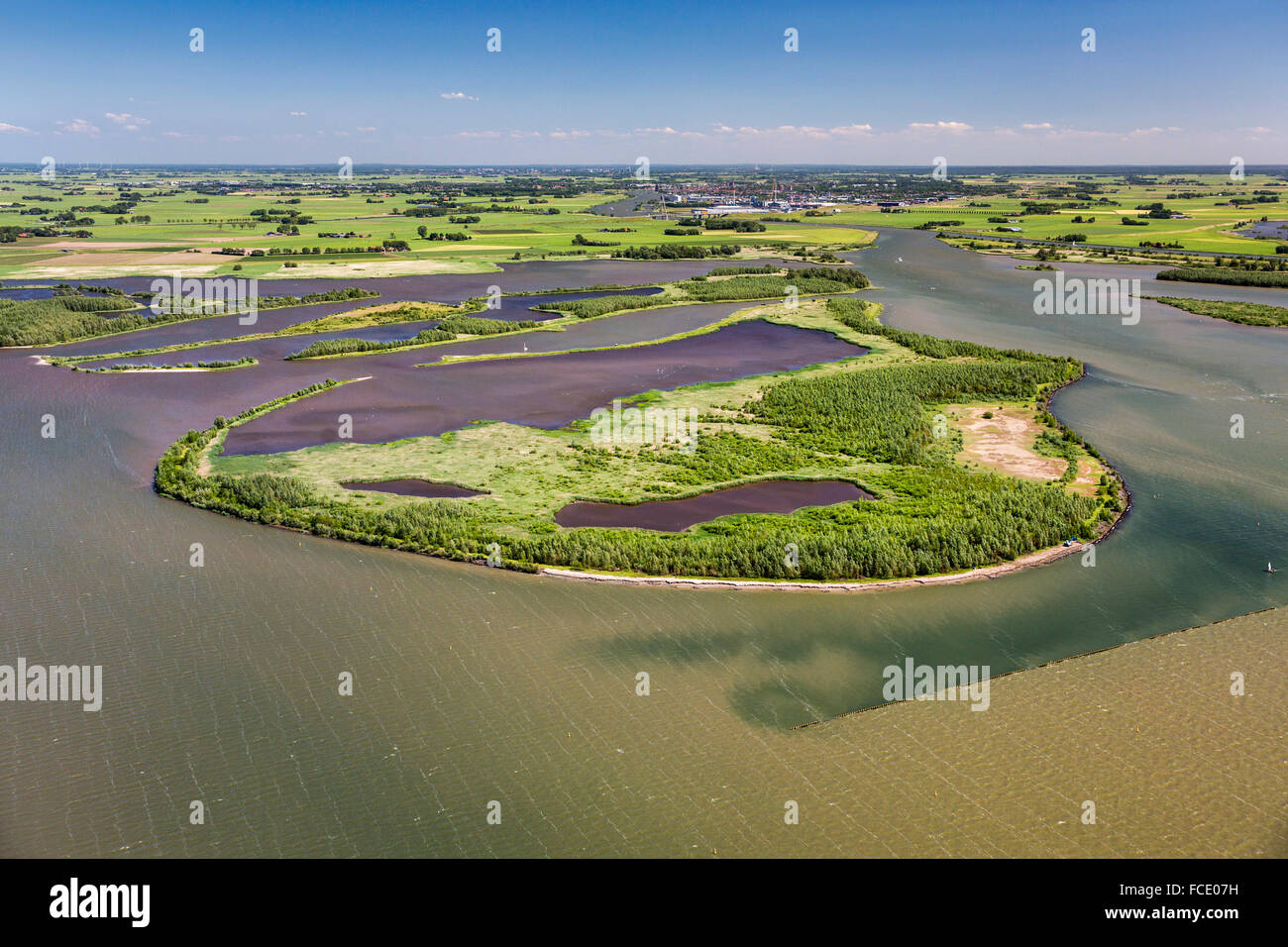 Netherlands, Kampen, Mound of IJssel river in lake called Ketelmeer. Nature reserve IJsselmoding. Aerial Stock Photo
