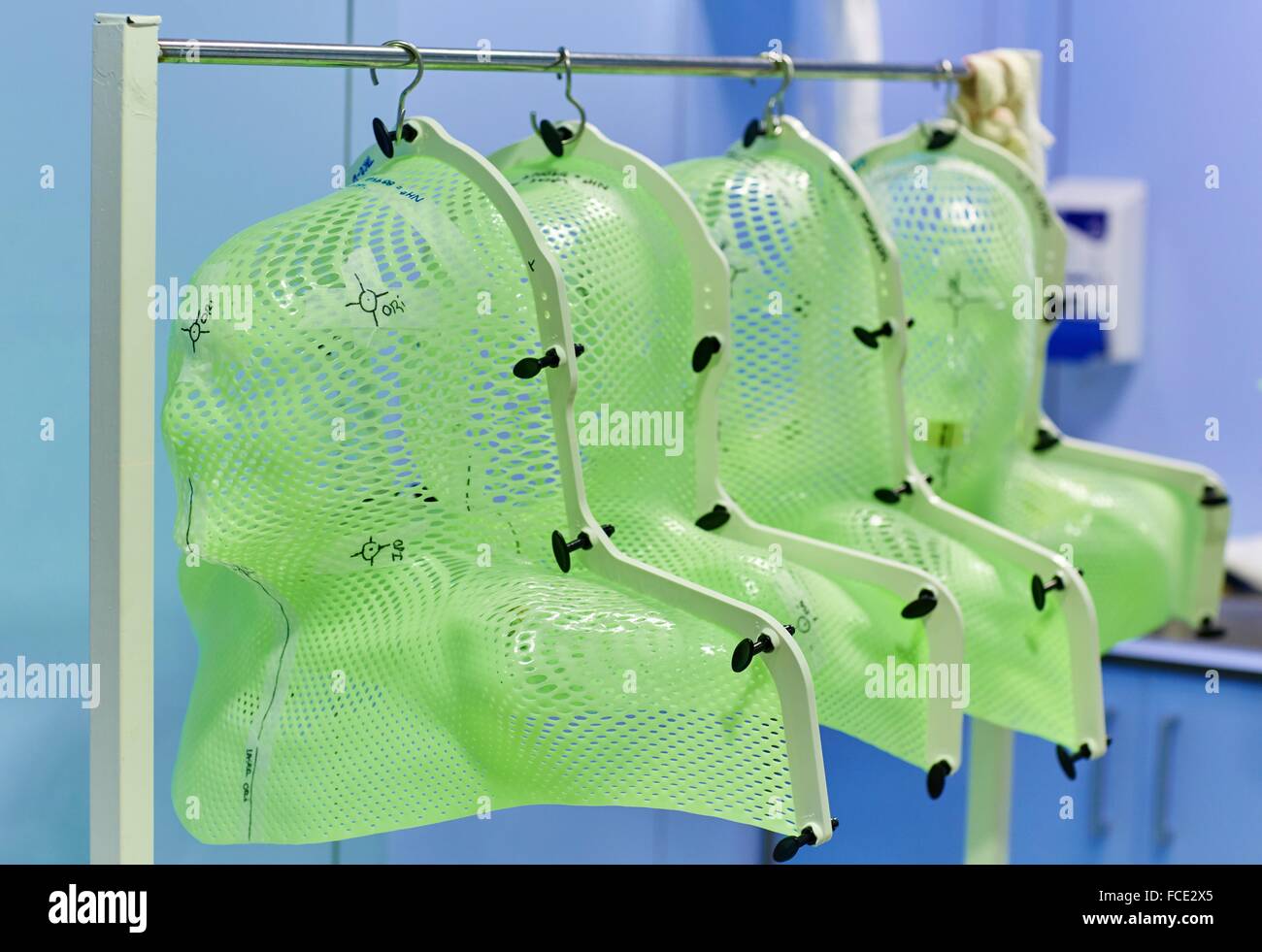 Plastic mesh masks used for radiation for the head and neck regions,  Treatment of cancer, Linear Particle Accelerator Stock Photo - Alamy