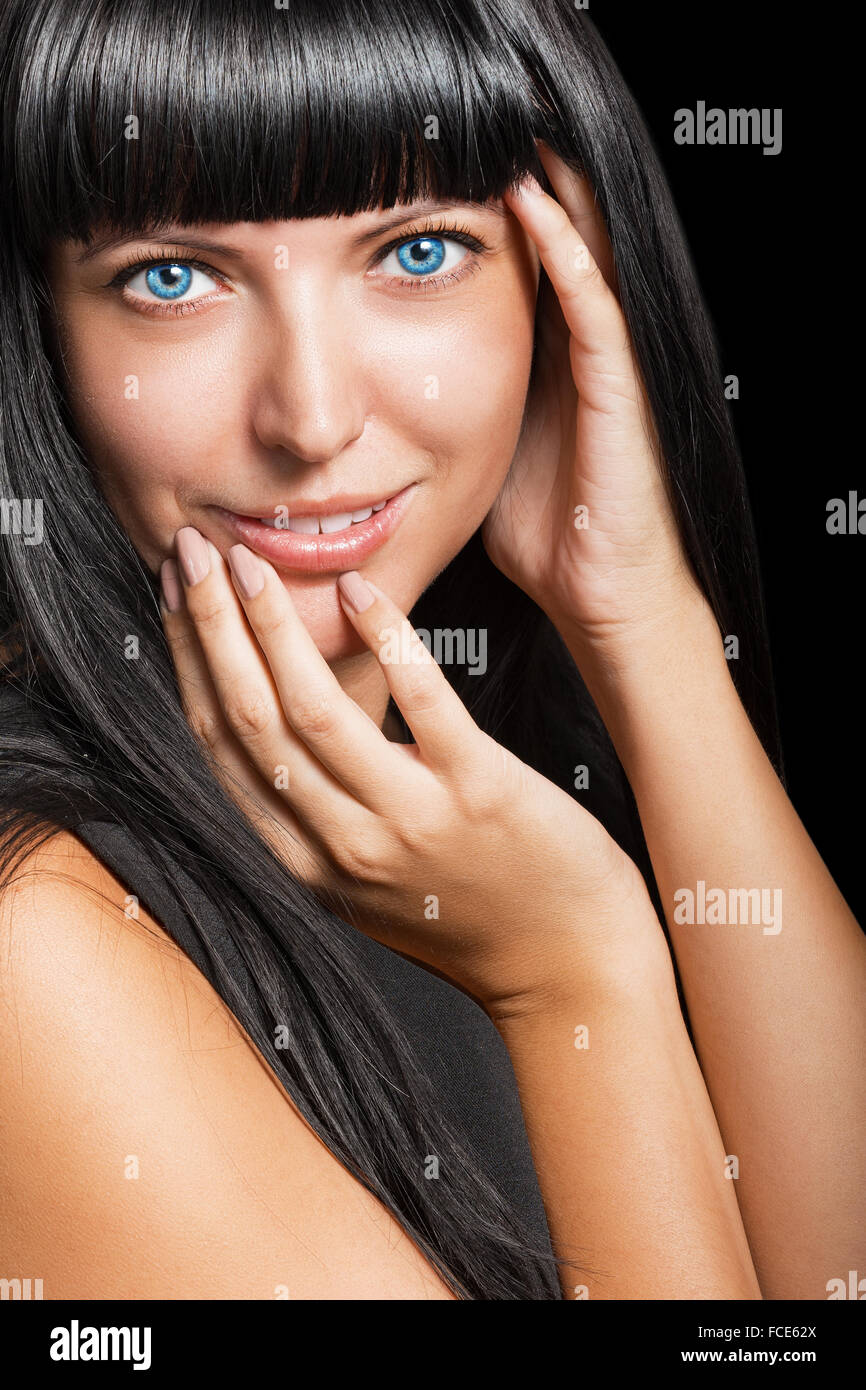 Portrait of a beautiful young woman on a black background Stock Photo