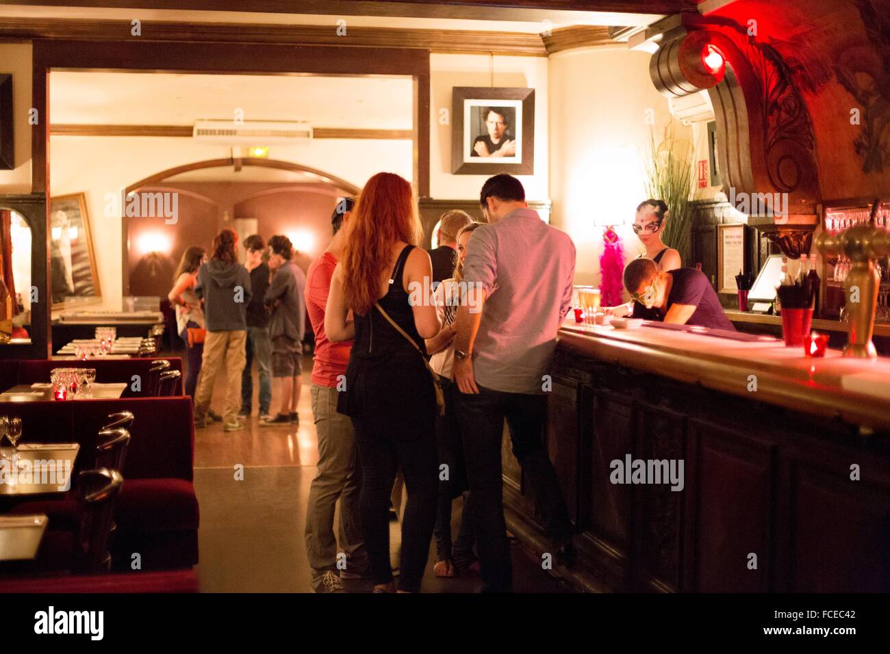 Group of people standing in a bar restaurant Stock Photo Alamy