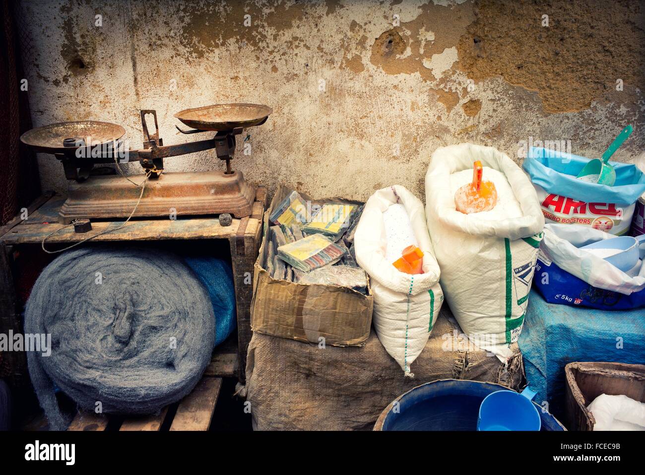 stall in a street market, selling soaps and cleaning supplies in bulk
