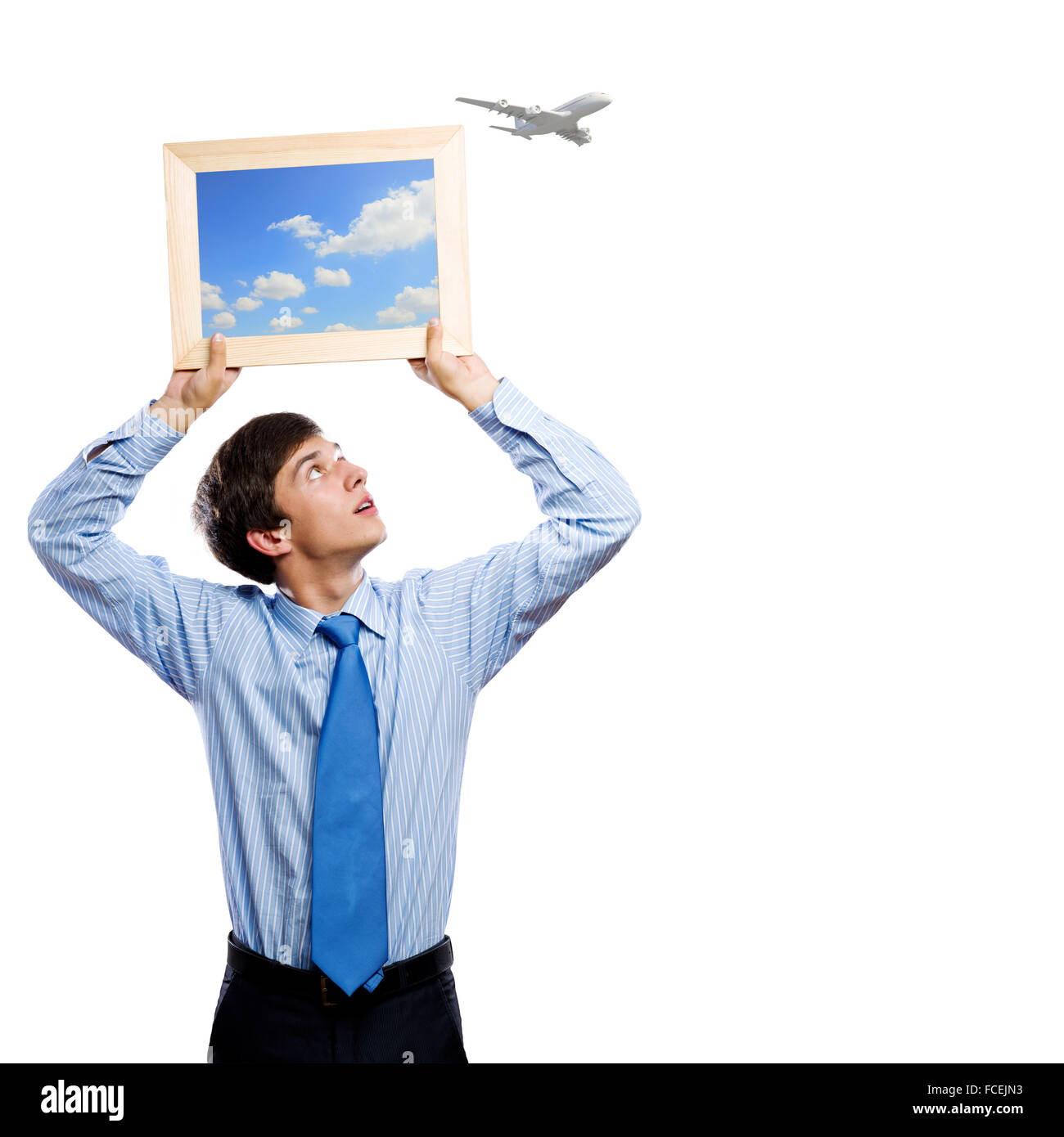 Handsome young man holding frame with pictures Stock Photo - Alamy