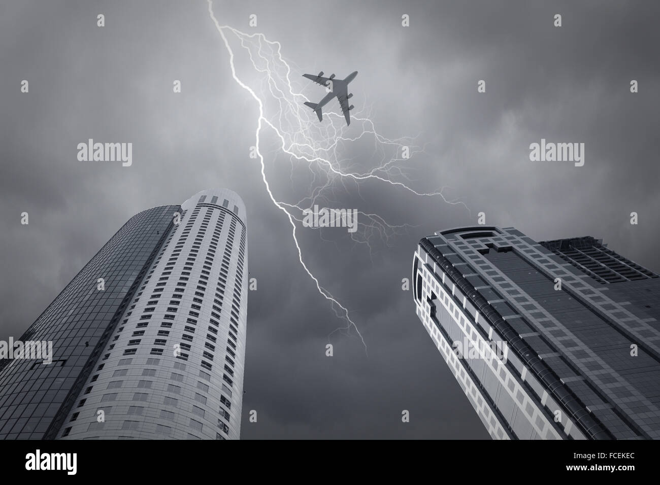Bottom view of airplane flying above skyscrapers Stock Photo - Alamy