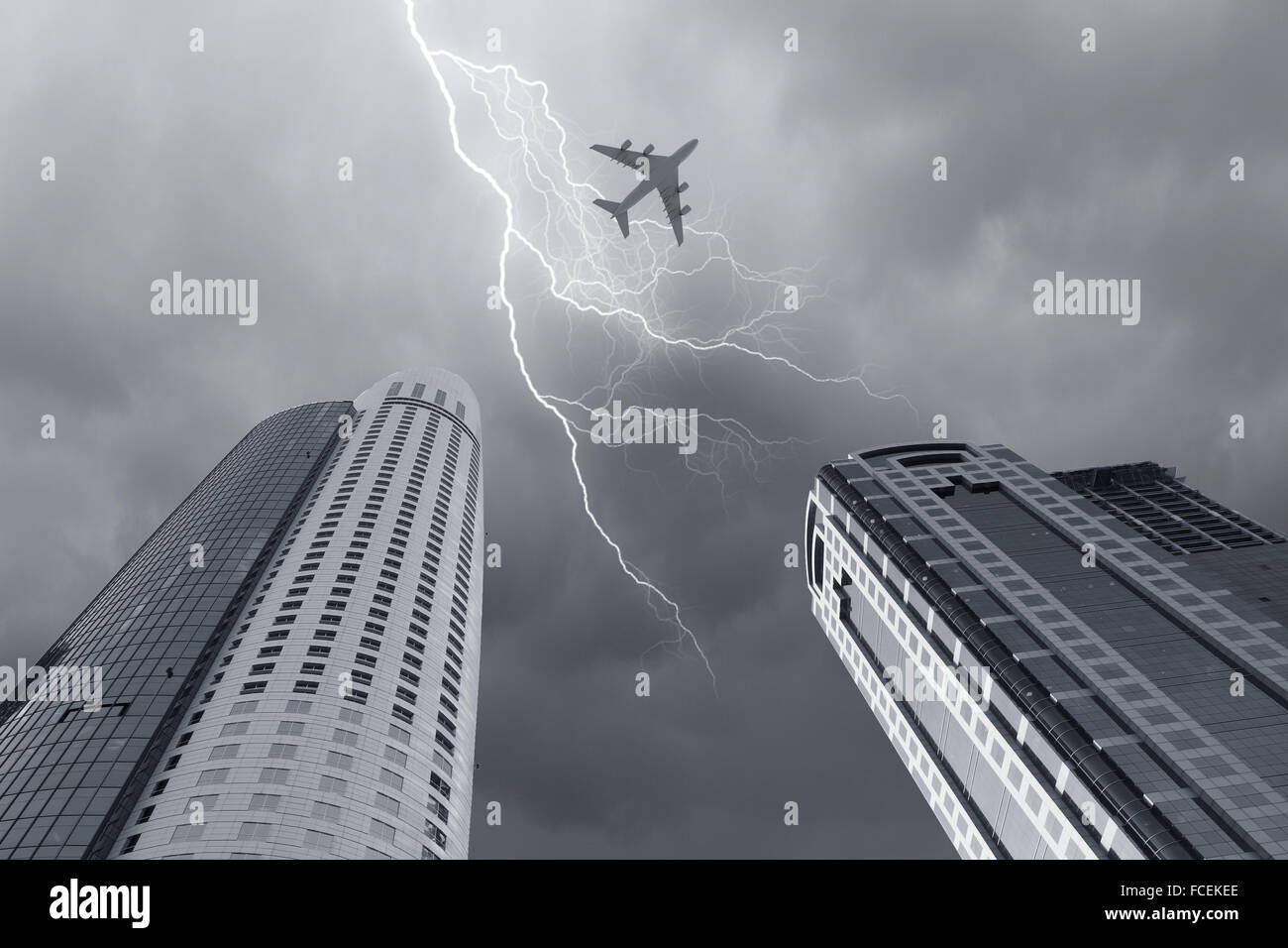 Bottom view of airplane flying above skyscrapers Stock Photo - Alamy