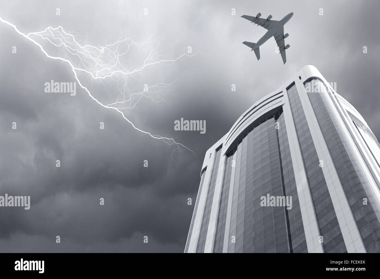 Bottom view of airplane flying above skyscrapers Stock Photo - Alamy