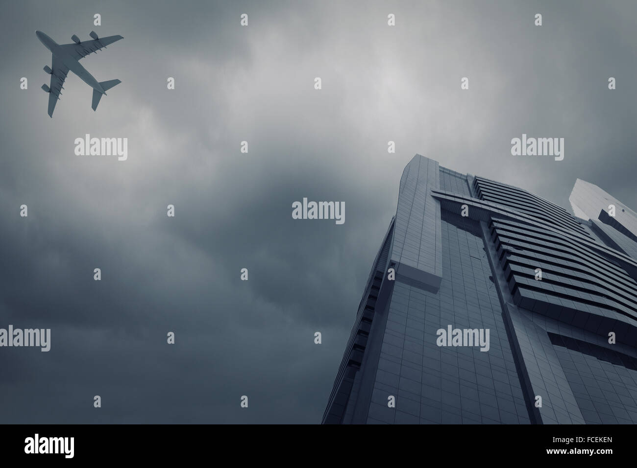Bottom view of airplane flying above skyscrapers Stock Photo - Alamy