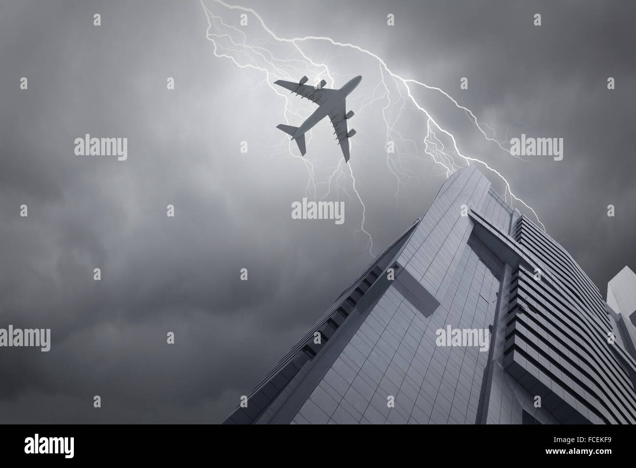 Bottom view of airplane flying above skyscrapers Stock Photo - Alamy
