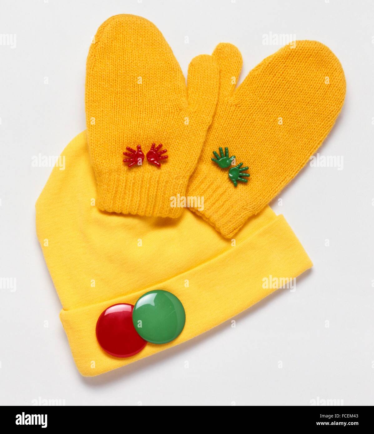 Yellow hat and gloves with red and green decorations Stock Photo