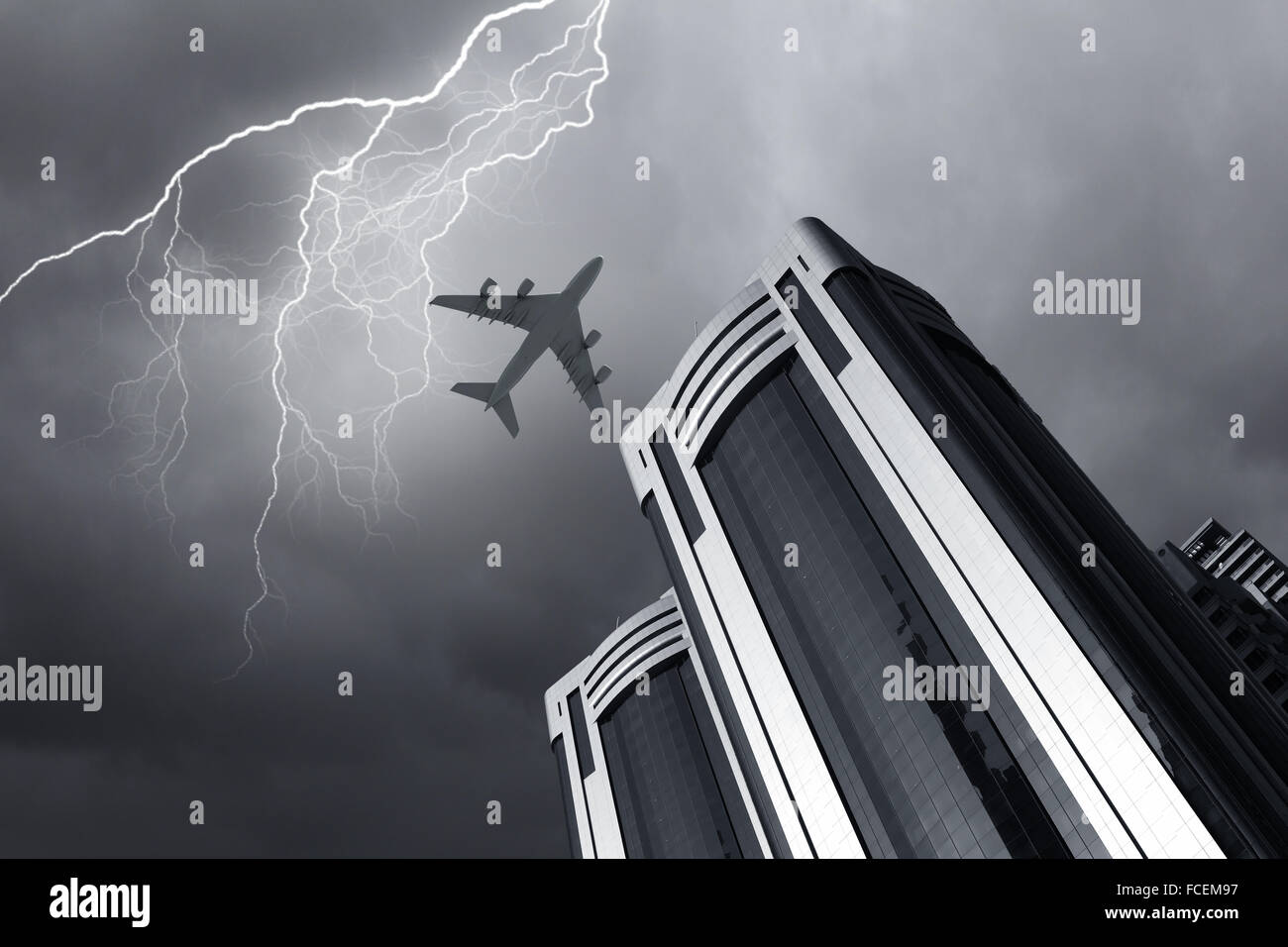 Bottom view of airplane flying above skyscrapers Stock Photo - Alamy