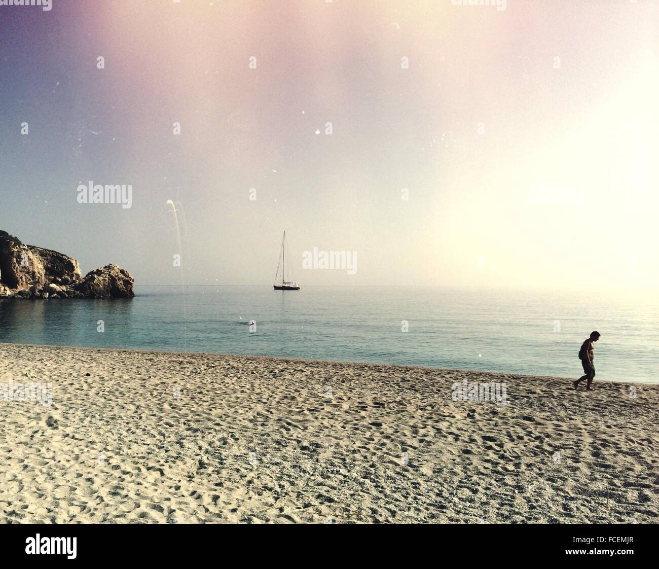 Man walking on the beach hi-res stock photography and images - Alamy