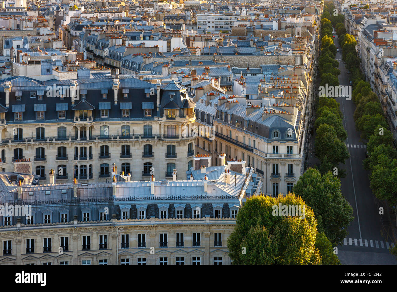 Aerial view of Paris 16th arrondissement with its haussmannian buildings, Paris rooftops and tree-lined Avenue Victor Hugo Stock Photo