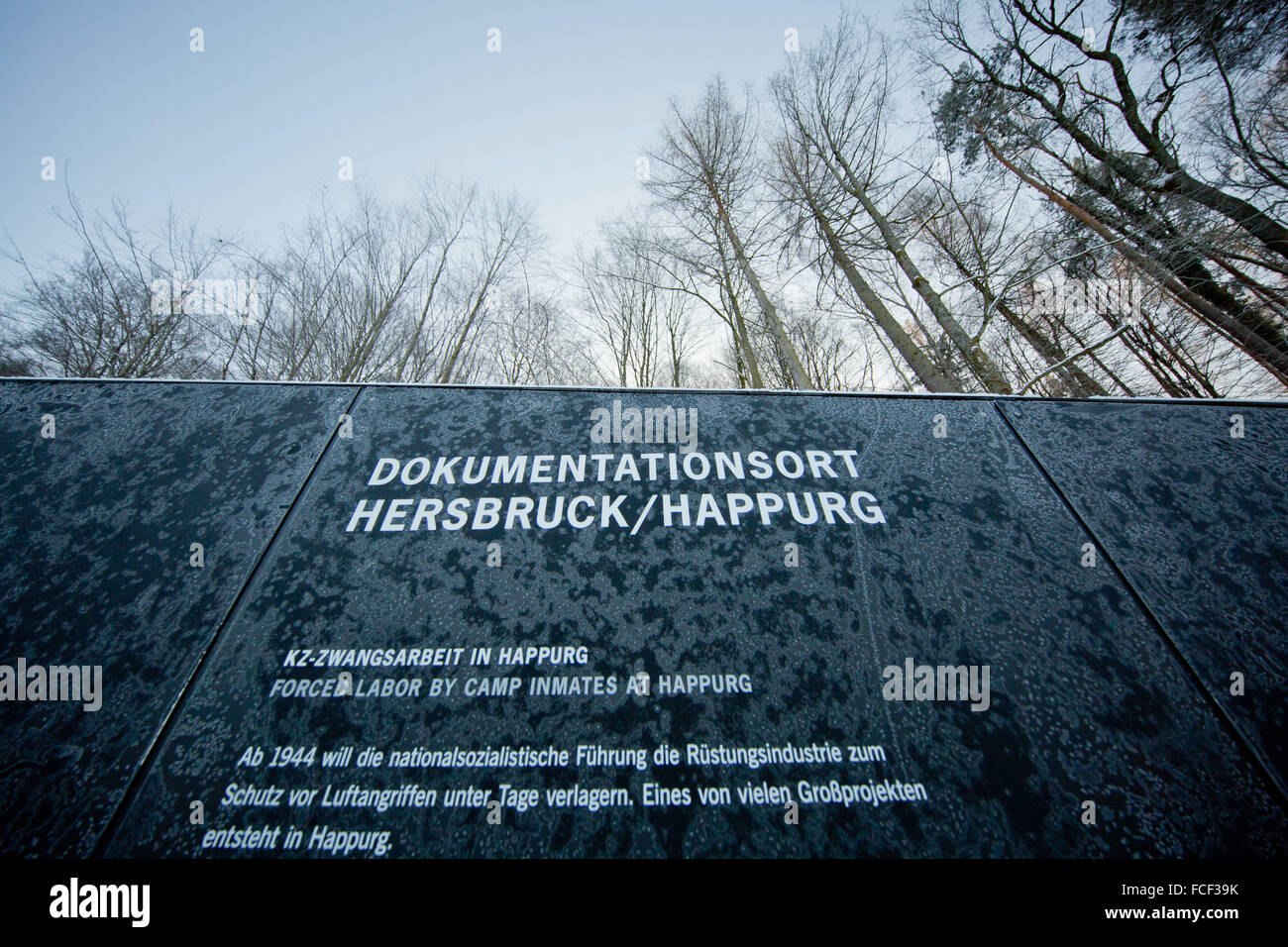 A view of an information panel in the snow covered surroundings of the Holocaust memorial on the premises of the concentration camp documentation centre Hersbruck/Happurg in Hersbruck, Germany, 22 January 2016. The second largest satellite camp of concentration camp Flossenbuerg was located in Hersbruck between July 1944 and April 1945. Up to 1,500 prisoners were held in the camp, who were used as forced labourer to build the facilities for an underground armaments factory. The documentation centre Hersbruck/Happurg will open officially on 25 January 2016. PHOTO: DANIEL KARMANN/dpa Stock Photo
