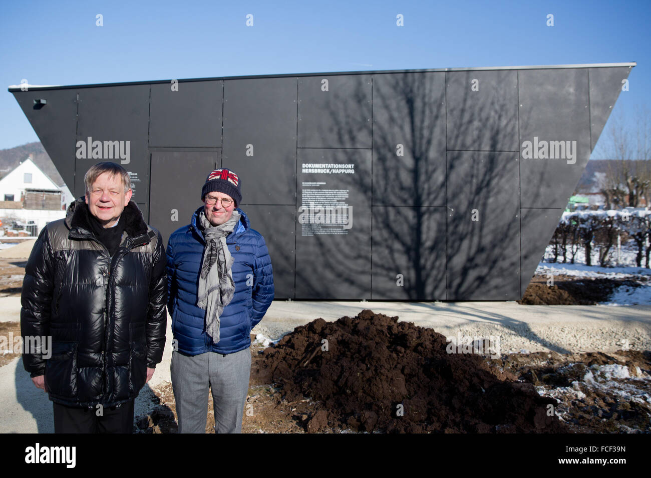 The director of the concentration camp memorial site Flossenbuerg, Joerg Skriebeleit (L) and Ulrich Fritz of the Foundation of Bavarian Memorial sites, stand in the snow covered surroundings on the premises of the concentration camp documentation centre Hersbruck/Happurg in Hersbruck, Germany, 22 January 2016. The second largest satellite camp of concentration camp Flossenbuerg was located in Hersbruck between July 1944 and April 1945. Up to 1,500 prisoners were held in the camp, who were used as forced labourer to build the facilities for an underground armaments factory. The docmentatio Stock Photo