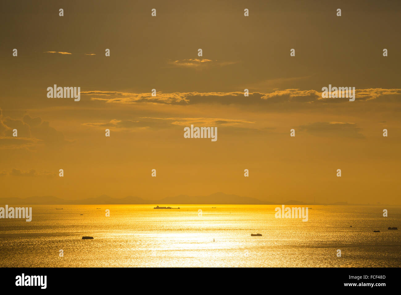 Sea sunset with sailing ships Stock Photo - Alamy